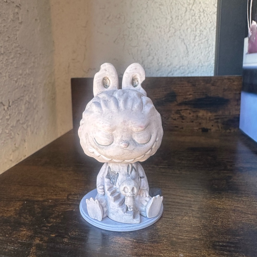 Almost hidden series grey figurine